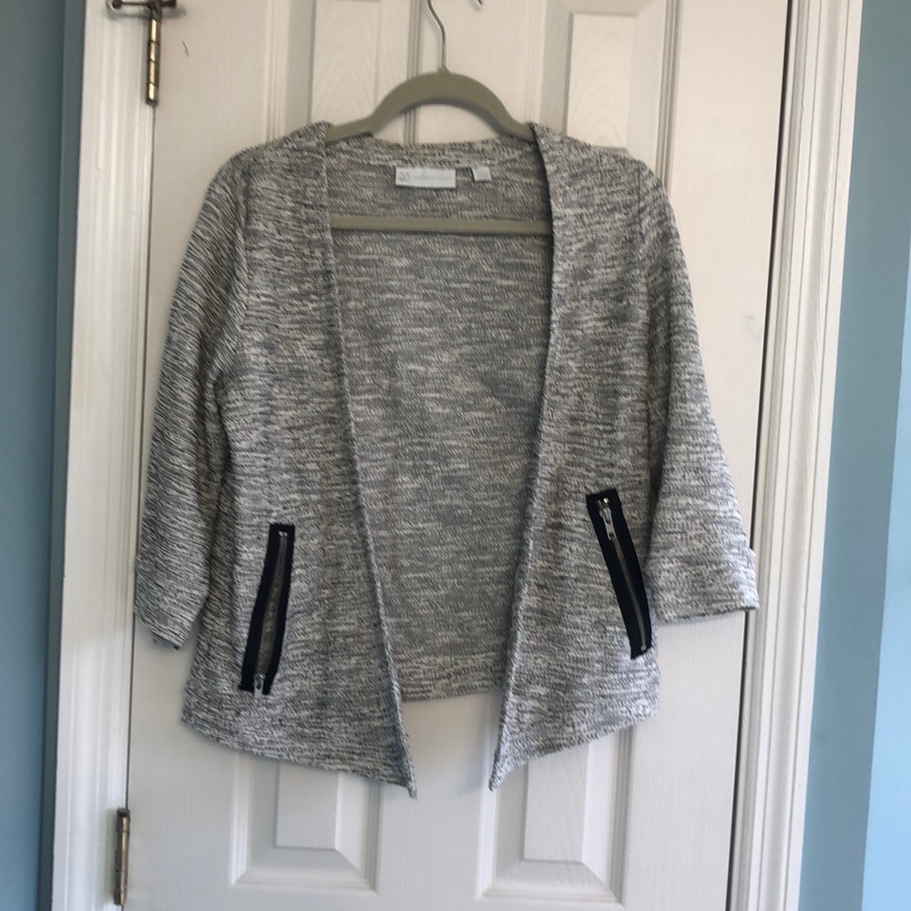 Grey cardigan with black zipper pockets